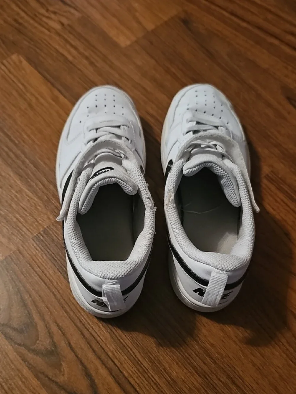 Nike Kids White Sneakers with Black Swoosh